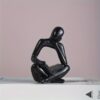1pc Abstract Figure Reading Book with One Hand Ornament